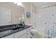 Bathroom featuring a shower/tub, vanity with solid surface countertop and modern fixtures at 111 Finsbury St, Durham, NC 27703