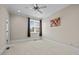 Carpeted bedroom with window and brown curtains and painted wall at 111 Finsbury St, Durham, NC 27703