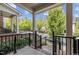 Inviting front porch with brick flooring, black railings, and views of the neighborhood at 111 Finsbury St, Durham, NC 27703