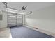 View of a spacious attached garage with an automatic door, and ample room for parking and storage at 111 Finsbury St, Durham, NC 27703