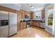 Well-equipped kitchen with stainless steel appliances, wooden cabinets, and hardwood floors at 111 Finsbury St, Durham, NC 27703