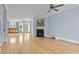 Spacious living area featuring hardwood floors, a fireplace, and an open layout into the kitchen at 111 Finsbury St, Durham, NC 27703