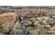 Aerial view showcases a neighborhood with mature trees scattered throughout the landscape at 112 Edgewood Dr, Roxboro, NC 27573