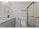 A bathroom offers a double sink vanity, a toilet, and a tile enclosed shower at 112 Edgewood Dr, Roxboro, NC 27573