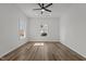 A bright bedroom features a ceiling fan, recessed lighting, and plank flooring at 112 Edgewood Dr, Roxboro, NC 27573
