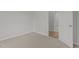 Neutral colored bedroom offers carpeted floors, a standard closet, and access to an adjacent room at 112 Edgewood Dr, Roxboro, NC 27573