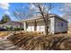 Charming single-story house with a front porch featuring brown wooden pillars at 112 Edgewood Dr, Roxboro, NC 27573