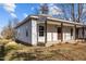 Exterior view of a cozy residence with a covered front porch, ideal for enjoying the outdoors at 112 Edgewood Dr, Roxboro, NC 27573