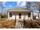 Charming single-story home featuring a welcoming front porch and well-maintained landscaping at 112 Edgewood Dr, Roxboro, NC 27573