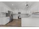 Modern kitchen featuring ample counter space, stainless steel appliances, and custom cabinetry at 112 Edgewood Dr, Roxboro, NC 27573