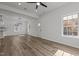 An open floor plan features plank flooring and large windows at 112 Edgewood Dr, Roxboro, NC 27573