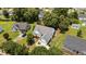 Aerial view of a home with lush landscaping, a well-manicured lawn, and a convenient two-car garage at 113 Kelly Ln, Clayton, NC 27520