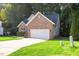 Beautiful brick home with attached two-car garage and meticulously kept front lawn at 1209 Waterford Green Dr Dr, Apex, NC 27502