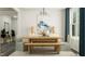 Elegant dining room with a wooden table, bench seating, and modern light fixtures at 1221 Coral Cay Bnd, Wake Forest, NC 27587
