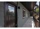 A view of the exterior hallway shows gray siding and black metal railings at 1309 Hudson Ave # D14, Durham, NC 27705