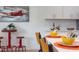 Bright eat-in kitchen features white cabinetry, quartz counters, and stylish island seating at 1309 Hudson Ave # D14, Durham, NC 27705