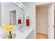 Bright bathroom with a modern vanity, light fixtures, large mirror, and white cabinetry at 1309 Hudson Ave # D5, Durham, NC 27705