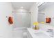 Bright bathroom features a tub shower, modern fixtures, and stylish decor at 1309 Hudson Ave # D5, Durham, NC 27705