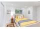 Bright bedroom features a window, closet, and neutral decor at 1309 Hudson Ave # D5, Durham, NC 27705
