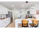 Bright kitchen featuring white cabinets, stainless steel appliances, and island with seating at 1309 Hudson Ave # D5, Durham, NC 27705