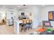 Modern kitchen features white cabinets, stainless steel appliances, and breakfast bar seating at 1309 Hudson Ave # D5, Durham, NC 27705