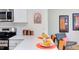 Modern kitchen with stainless steel appliances, quartz counters, and barstool seating at 1309 Hudson Ave # D5, Durham, NC 27705