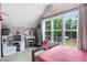 Bedroom with vaulted ceiling, large windows and natural light at 132 Ironwood Ln, Clayton, NC 27520