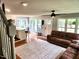 Inviting living room featuring hardwood floors, natural light, and an open floorplan to the kitchen at 132 Ironwood Ln, Clayton, NC 27520