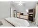 Serene bedroom features plush carpeting, a ceiling fan, and neutral décor for a relaxing atmosphere at 132 Ironwood Ln, Clayton, NC 27520