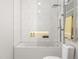 Bright bathroom features white marble tiling, a tub with glass enclosure, and a heated towel rack at 17 Runneymede Pl, Smithfield, NC 27577