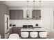 Stylish kitchen with gray cabinets, white countertops, and a modern island at 17 Runneymede Pl, Smithfield, NC 27577