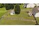 Expansive, fenced backyard featuring a pergola, storage shed, and mature trees, perfect for outdoor living and entertaining at 1713 Mclaurin Ln, Fuquay Varina, NC 27526