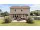 Exterior backyard view of a two-story home featuring a patio and pergola at 1713 Mclaurin Ln, Fuquay Varina, NC 27526