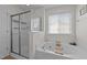 Bathroom with a soaking tub, a separate shower, and a window that lets in plenty of natural light at 1713 Mclaurin Ln, Fuquay Varina, NC 27526