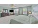 Bedroom featuring a comfortable king-sized bed, carpeted floors, and natural light from the windows at 1713 Mclaurin Ln, Fuquay Varina, NC 27526