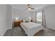 Bright bedroom with a queen bed, decorative pillows, and carpeted floor at 1713 Mclaurin Ln, Fuquay Varina, NC 27526