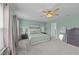 Bedroom featuring a ceiling fan, a comfortable king-sized bed, and carpeted floors at 1713 Mclaurin Ln, Fuquay Varina, NC 27526
