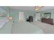 Bedroom featuring a comfortable king-sized bed, carpeted floors, and views to an ensuite bathroom at 1713 Mclaurin Ln, Fuquay Varina, NC 27526