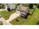 Two-story home with lush landscaping, a charming porch, and a two-car garage, offering comfort and style at 1713 Mclaurin Ln, Fuquay Varina, NC 27526