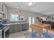 Open kitchen with stainless appliances, ample counter space, and an adjacent living area at 1713 Mclaurin Ln, Fuquay Varina, NC 27526