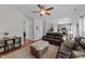 Open-concept living room with hardwood floors, comfortable seating, and ample space at 1713 Mclaurin Ln, Fuquay Varina, NC 27526