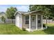 A shed in the backyard with siding and a small covered porch at 1713 Mclaurin Ln, Fuquay Varina, NC 27526