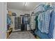 Organized walk-in closet offering ample storage with shelving and hanging racks for clothes and accessories at 1713 Mclaurin Ln, Fuquay Varina, NC 27526