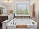 Bright bathroom showcasing a soaking tub, a large window, and stylish fixtures for a relaxing experience at 1806 Pattersons Mill Rd, Durham, NC 27703