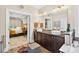 Elegant bathroom boasting double sinks, a soaking tub, and modern fixtures with stylish decor at 1806 Pattersons Mill Rd, Durham, NC 27703