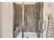Modern bathroom featuring a glass-enclosed shower, sleek tile work, and contemporary fixtures at 1806 Pattersons Mill Rd, Durham, NC 27703