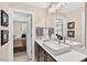 Modern bathroom featuring a quartz countertop, stylish fixtures, and a large mirror at 1806 Pattersons Mill Rd, Durham, NC 27703
