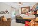This bedroom features unique decor, including a cool motorcycle art piece and tiger-striped furniture, creating a fun atmosphere at 1806 Pattersons Mill Rd, Durham, NC 27703