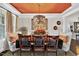 Formal dining room features unique lighting, decor and seating at 1806 Pattersons Mill Rd, Durham, NC 27703