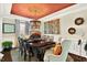 Lovely dining area with dark hardwood floors, designer ceiling and ornate lighting at 1806 Pattersons Mill Rd, Durham, NC 27703